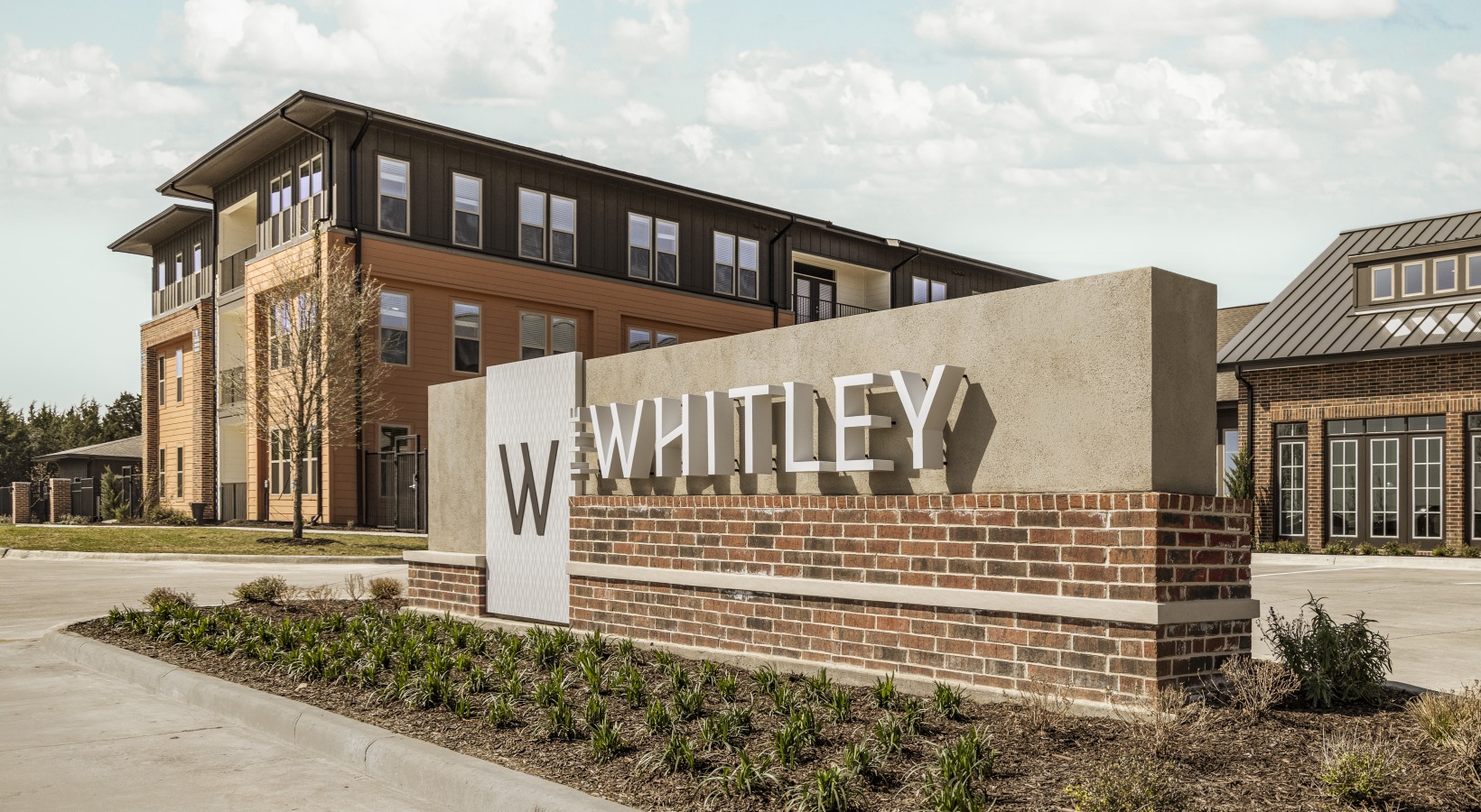 building with sign in front