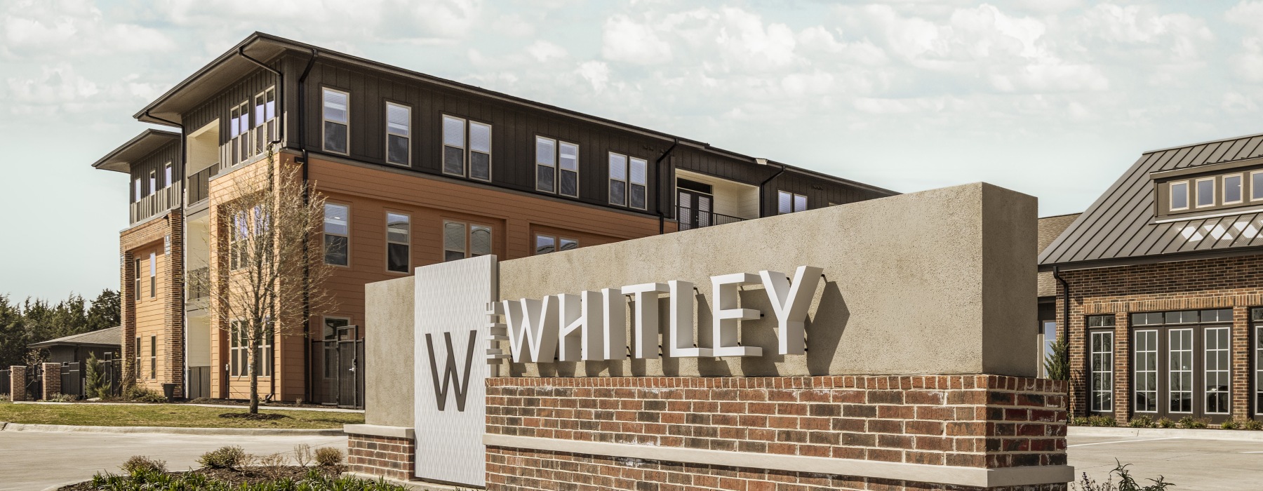 building with sign in front