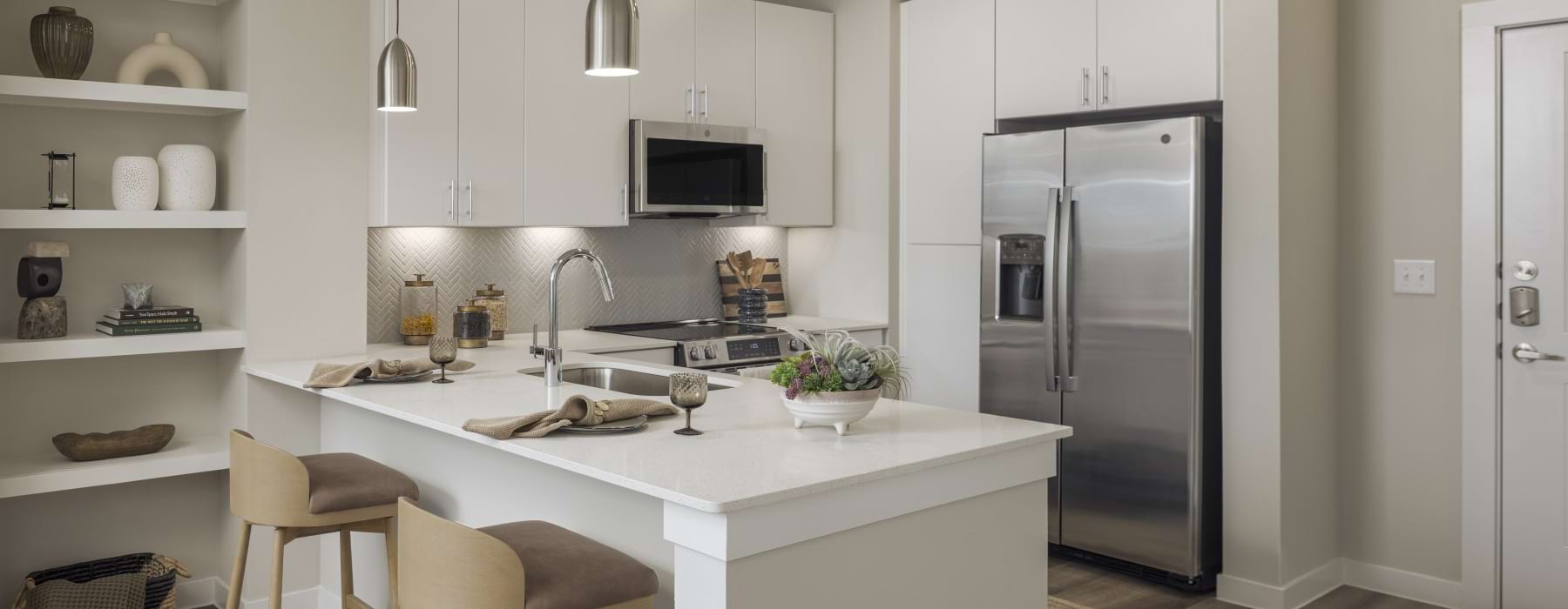 a kitchen with bar stools
